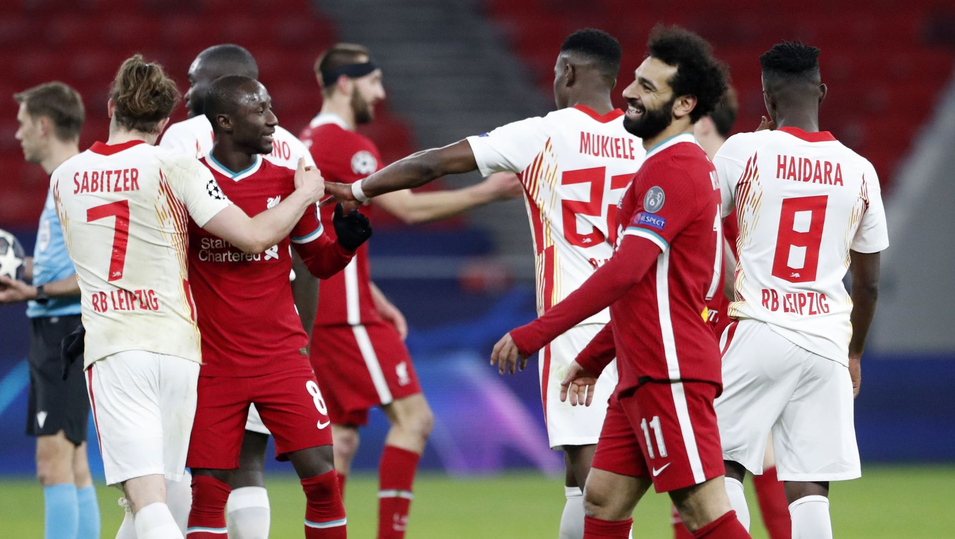 Soccer Football - Champions League - Round of 16 Second Leg - Liverpool v RB Leipzig - Puskas Arena, Budapest, Hungary - March 10, 2021 Liverpool's Mohamed Salah celebrates with teammates after the match Soccer Football - Champions League - Round of 16 Second Leg - Liverpool v RB Leipzig - Puskas Arena, Budapest, Hungary - March 10, 2021 Liverpool's Mohamed Salah celebrates with teammates after the match - Sputnik International, 1920, 23.03.2021