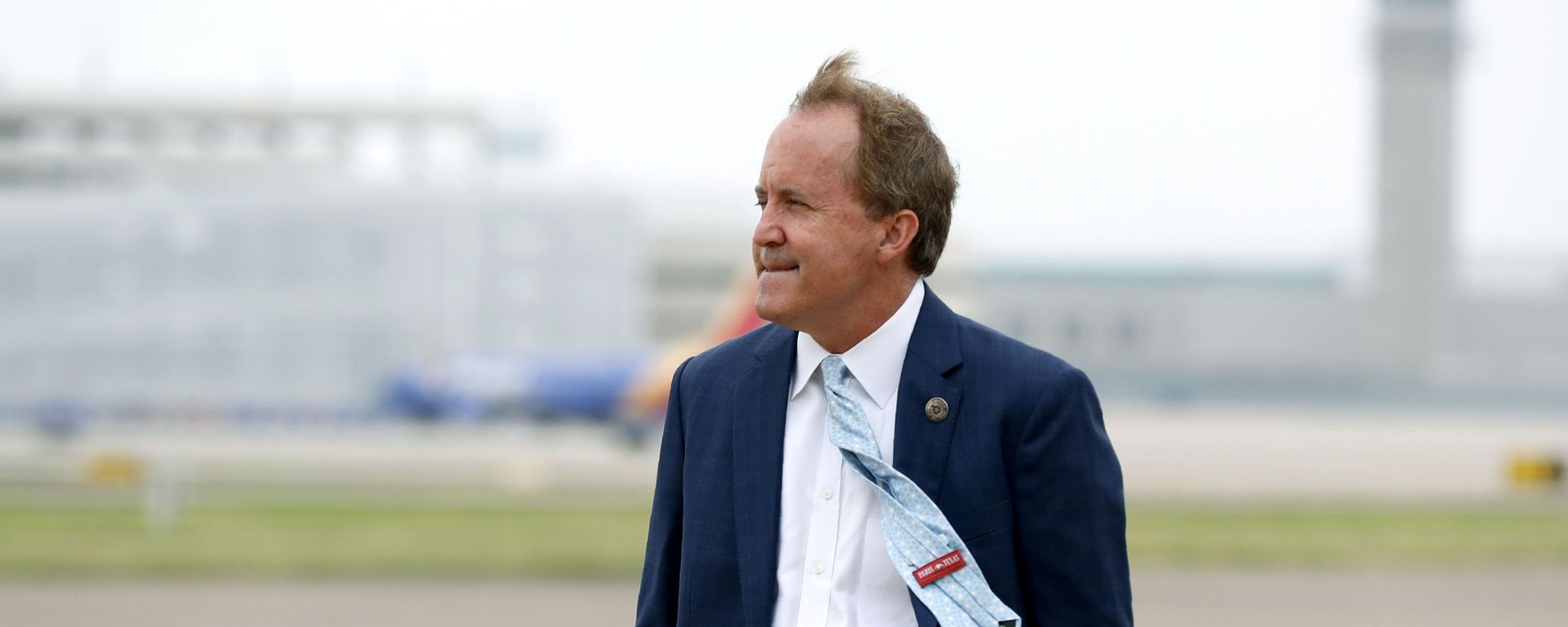In this June 28, 2020 file photo, Texas' Attorney General Ken Paxton waits on the flight line for the arrival of Vice President Mike Pence at Love Field in Dallas. The mass exodus of Paxton's top staff over accusations of bribery against their former boss has left the Republicans seeking $43 million in public funds to replace some of them with outside lawyers to lead a high-profile antitrust lawsuit against Google. - Sputnik International, 1920, 27.05.2023