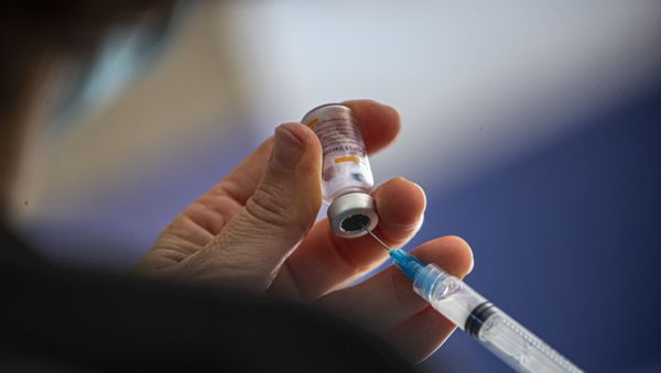 A healthcare worker prepares a dose of the Sinovac COVID-19 vaccine at the Carmela Carvajal public school in Santiago, Chile, Wednesday, March 10, 2021 - Sputnik International