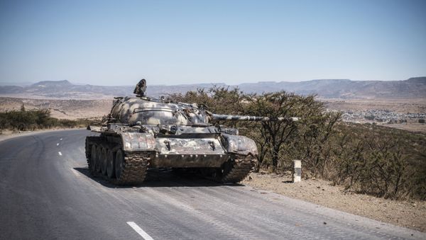 A damaged Ethiopian tank sits by the roadside in Tigray, close to the border with Sudan - Sputnik International