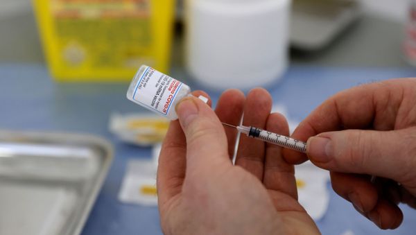 FILE PHOTO: A health worker prepares a syringe with a dose of the Moderna COVID-19 vaccine at a vaccination center in Calais as part of the coronavirus disease (COVID-19) vaccination campaign in France, March 4, 2021. - Sputnik International