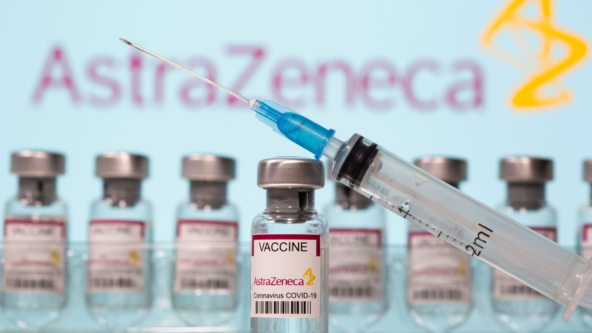 Vials labelled AstraZeneca COVID-19 Coronavirus Vaccine and a syringe are seen in front of a displayed AstraZeneca logo in this illustration taken March 10, 2021. REUTERS/Dado Ruvic/Illustration Vials labelled AstraZeneca COVID-19 Coronavirus Vaccine and a syringe are seen in front of a displayed AstraZeneca logo in this illustration taken March 10, 2021. REUTERS/Dado Ruvic/Illustration - Sputnik International, 1920, 12.05.2021