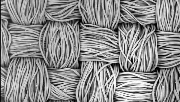 The fibres of a polyester mask seen through a microscope. - Sputnik International