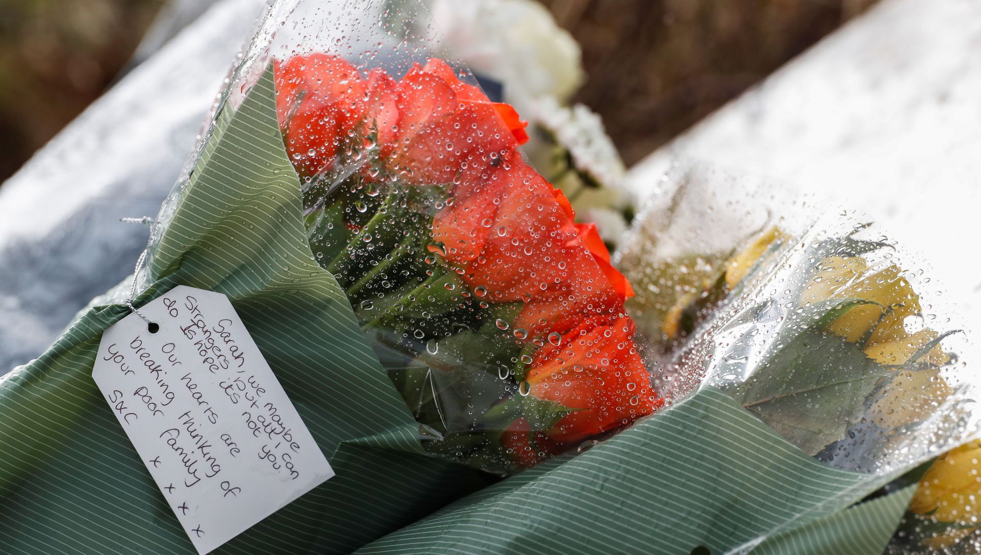 Flowers placed by police officers at the golf course entrance are pictured, as the investigation into the disappearance of Sarah Everard continues, in Ashford, Britain, March 11, 2021 Flowers placed by police officers at the golf course entrance are pictured, as the investigation into the disappearance of Sarah Everard continues, in Ashford, Britain, March 11, 2021 - Sputnik International, 1920, 13.03.2021