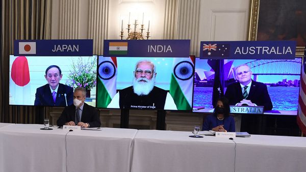 (On screens, L-R) Japanese Prime Minister Yoshihide Suga, Indian Prime Minister Narendra Modi and Australian Prime Minister Scott Morrison listen during a virtual meeting of the Quad alliance members: Australia, India, Japan and the US, in the State Dining Room of the White House in Washington, DC, on March 12, 2021. (On screens, L-R) Japanese Prime Minister Yoshihide Suga, Indian Prime Minister Narendra Modi and Australian Prime Minister Scott Morrison listen during a virtual meeting of the Quad alliance members: Australia, India, Japan and the US, in the State Dining Room of the White House in Washington, DC, on March 12, 2021. - Sputnik International