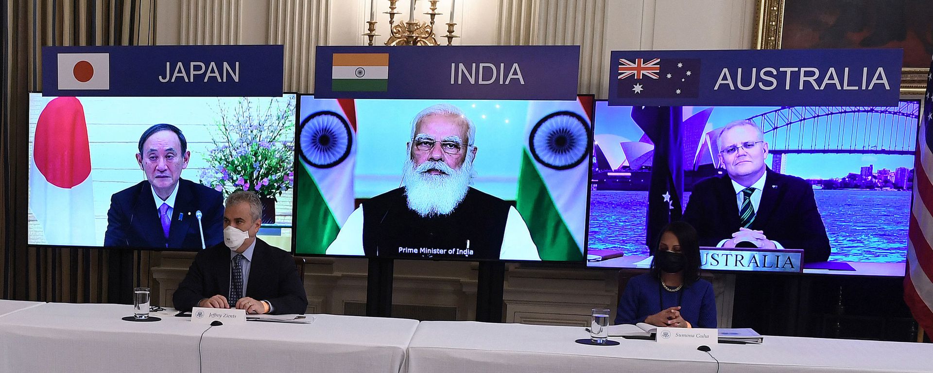 (On screens, L-R) Japanese Prime Minister Yoshihide Suga, Indian Prime Minister Narendra Modi and Australian Prime Minister Scott Morrison listen during a virtual meeting of the Quad alliance members: Australia, India, Japan and the US, in the State Dining Room of the White House in Washington, DC, on March 12, 2021. (On screens, L-R) Japanese Prime Minister Yoshihide Suga, Indian Prime Minister Narendra Modi and Australian Prime Minister Scott Morrison listen during a virtual meeting of the Quad alliance members: Australia, India, Japan and the US, in the State Dining Room of the White House in Washington, DC, on March 12, 2021. - Sputnik International, 1920, 22.04.2021