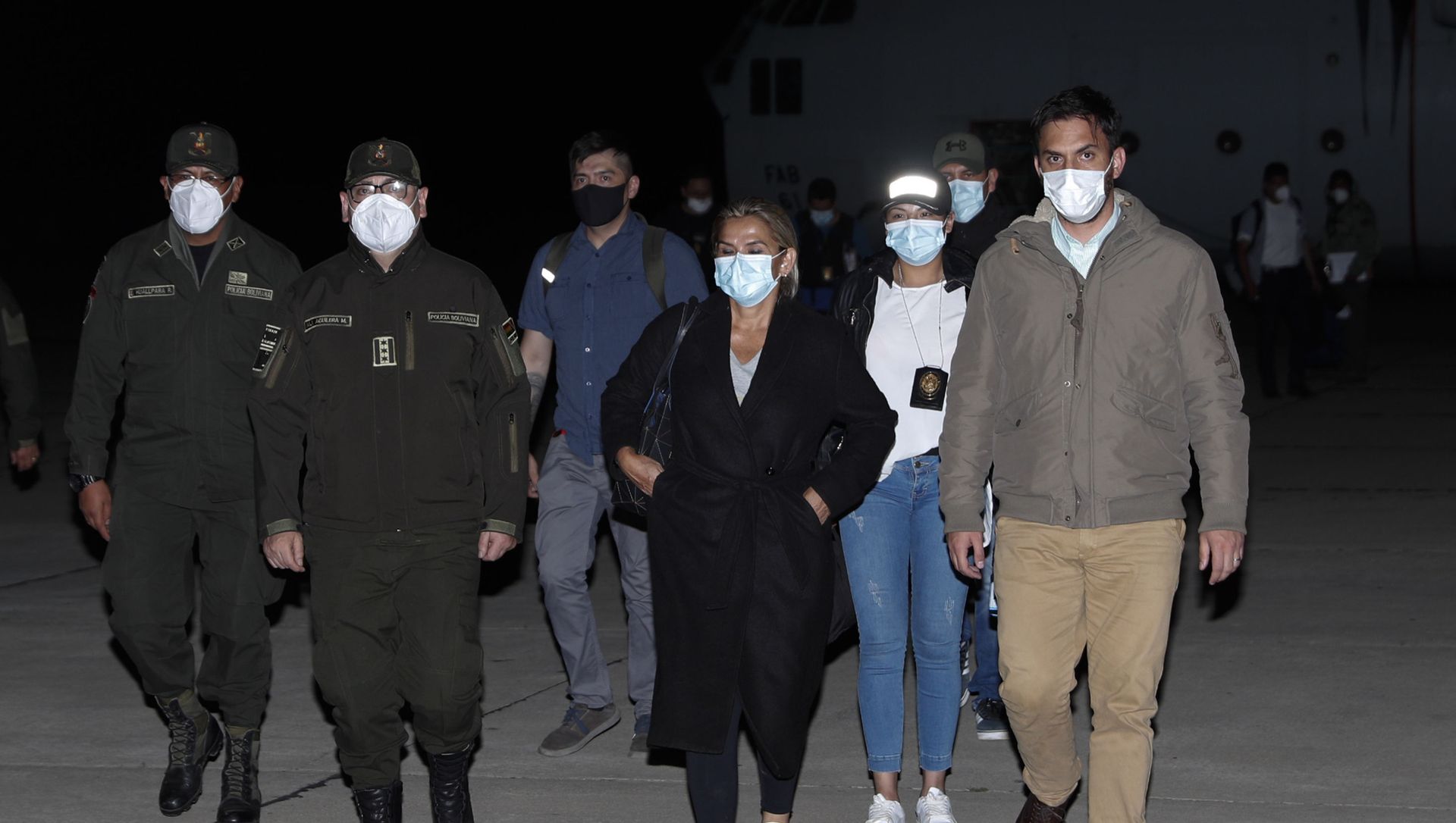 Bolivia's former interim President Jeanine Anez, center, who has been detained, is escorted by Government Minister Carlos Eduardo Del Castillo, right, and Bolivian Police Commander Jhonny Aguilera, at the military airport in El Alto, Bolivia, Saturday, March 13, 2021. Bolivia's former interim President Jeanine Anez, center, who has been detained, is escorted by Government Minister Carlos Eduardo Del Castillo, right, and Bolivian Police Commander Jhonny Aguilera, at the military airport in El Alto, Bolivia, Saturday, March 13, 2021. - Sputnik International, 1920, 28.04.2021