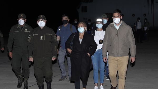 Bolivia's former interim President Jeanine Anez, center, who has been detained, is escorted by Government Minister Carlos Eduardo Del Castillo, right, and Bolivian Police Commander Jhonny Aguilera, at the military airport in El Alto, Bolivia, Saturday, March 13, 2021. Bolivia's former interim President Jeanine Anez, center, who has been detained, is escorted by Government Minister Carlos Eduardo Del Castillo, right, and Bolivian Police Commander Jhonny Aguilera, at the military airport in El Alto, Bolivia, Saturday, March 13, 2021. - Sputnik International