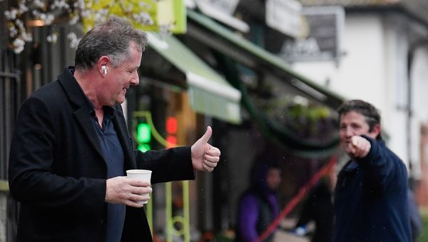 Journalist and television presenter Piers Morgan gestures back to a passerby as he walks near his house, after he left his high-profile breakfast slot with the broadcaster ITV, following his long-running criticism of Prince Harry's wife Meghan, in London, Britain, March 10, 2021 - Sputnik International