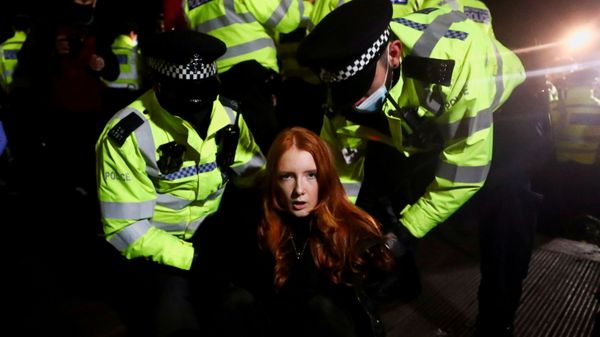 Police detain a woman as people gather at a memorial site in Clapham Common Bandstand, following the kidnap and murder of Sarah Everard, in London, Britain Police detain a woman as people gather at a memorial site in Clapham Common Bandstand, following the kidnap and murder of Sarah Everard, in London, Britain - Sputnik International