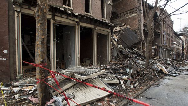 FILE - In this Dec. 31, 2020, file photo, debris surrounds buildings that were damaged in a Christmas Day explosion in Nashville, Tenn. The FBI investigation into whether the Nashville bombing was a terrorist act has sparked criticism about a possible racial double standard and drawn questions from downtown business owners whose insurance coverage could be affected by the bureauâ€™s assessment. - Sputnik International