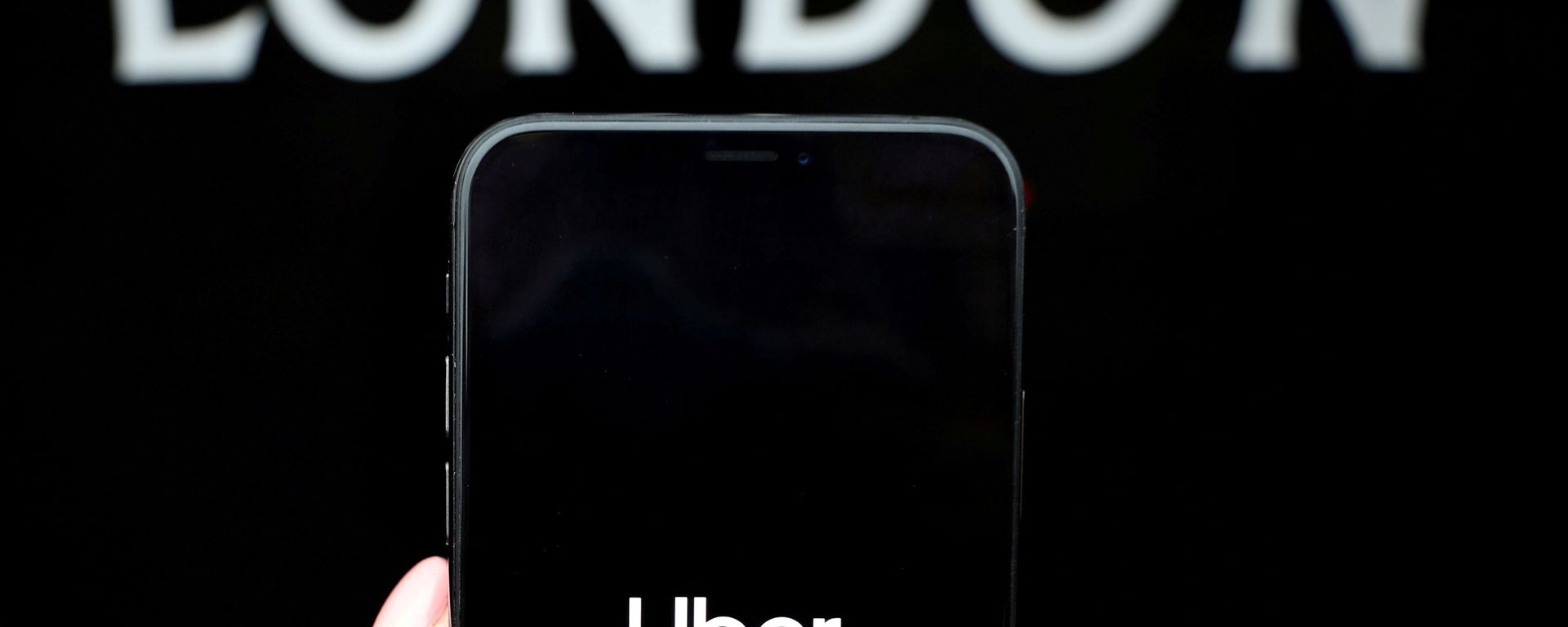 The Uber logo is displayed on a mobile phone in this picture illustration taken November 25, 2019.  - Sputnik International, 1920, 17.03.2021