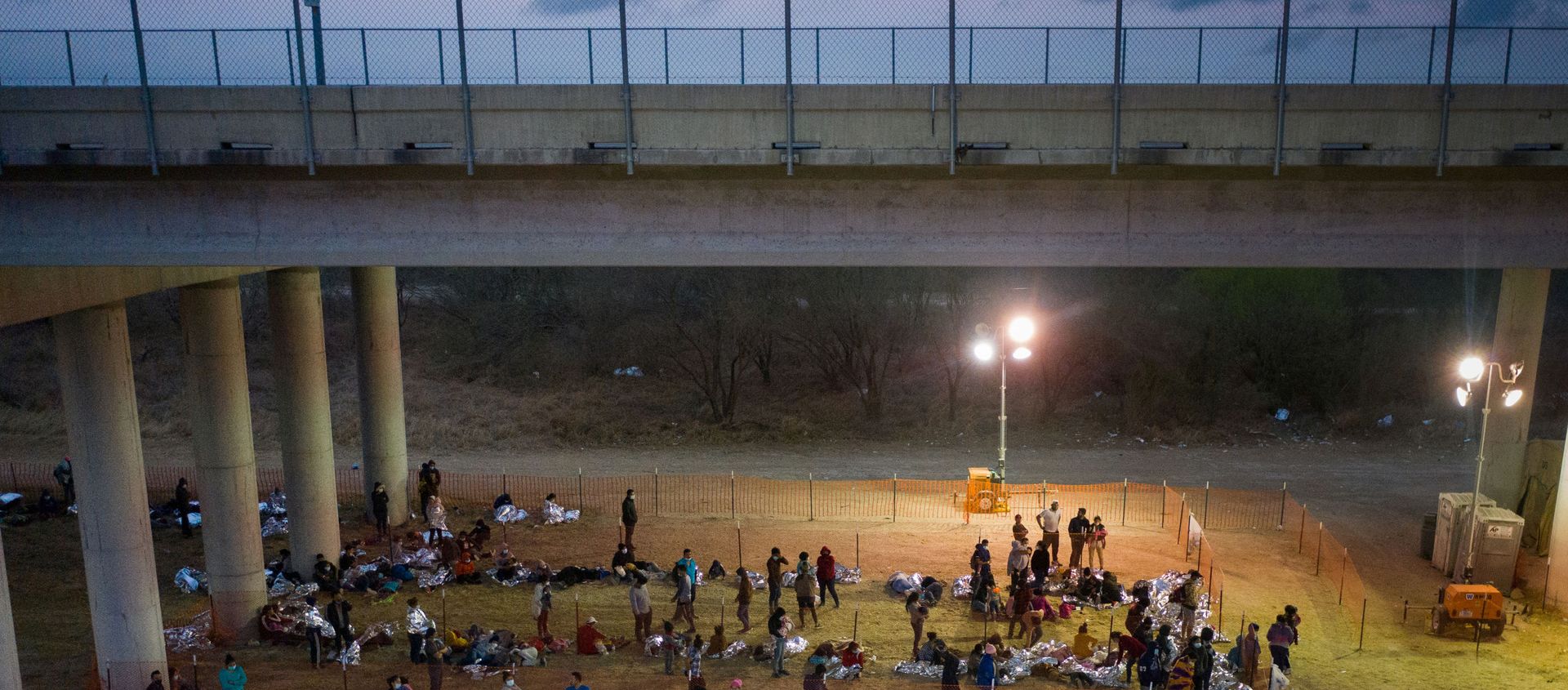 Asylum seeking migrant families and unaccompanied minors from Central America take refuge in a makeshift US Customs and Border Protection processing centre under the Anzalduas International Bridge after crossing the Rio Grande river into the United States from Mexico in Granjeno, Texas, 12 March 2021. REUTERS/Adrees Latif/File Photo Asylum seeking migrant families and unaccompanied minors from Central America take refuge in a makeshift US Customs and Border Protection processing centre under the Anzalduas International Bridge after crossing the Rio Grande river into the United States from Mexico in Granjeno, Texas, 12 March 2021. REUTERS/Adrees Latif/File Photo - Sputnik International, 1920, 20.03.2021