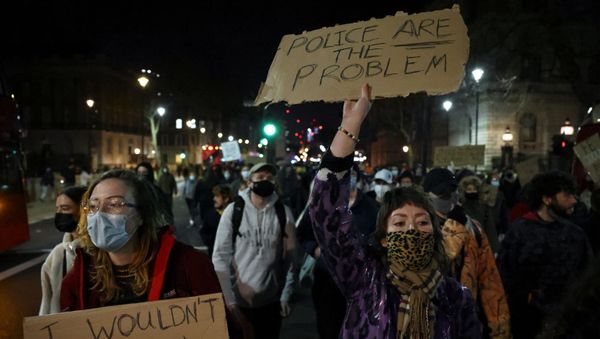 Demonstrators holding placards walk in a protest, following the kidnap and murder of Sarah Everard, in London, Britain, March 16, 2021.  - Sputnik International