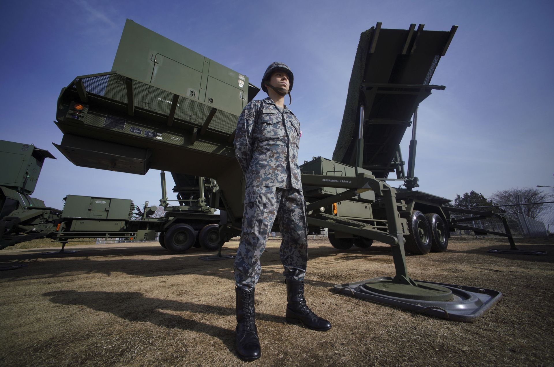 A member of Japan Ground Self-Defense Force stands guard next to a surface-to-air Patriot Advanced Capability-3 (PAC-3) missile interceptor launcher vehicle A member of Japan Ground Self-Defense Force stands guard next to a surface-to-air Patriot Advanced Capability-3 (PAC-3) missile interceptor launcher vehicle - Sputnik International, 1920, 07.06.2022