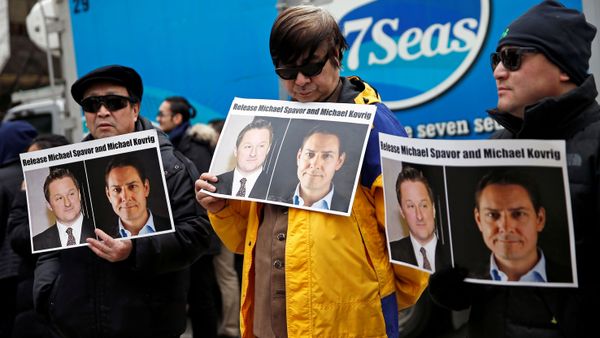 People hold placards calling for China to release Canadian detainees Michael Spavor and Michael Kovrig outside a court hearing for Huawei Technologies Chief Financial Officer Meng Wanzhou at the B.C. Supreme Court in Vancouver, British Columbia, Canada, March 6, 2019. - Sputnik International