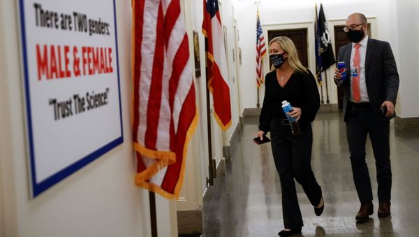 U.S. Rep. Marjorie Taylor Greene (R-GA) arrives at her office after she hung a poster outside reading There are TWO genders, MALE & FEMALE. Trust The Science! in reaction to a trans pride flag hung across the hall outside the office of Rep. Marie Newman (D-Il) in the midst of contentious debate over The Equality Act being debated by the House on Capitol Hill in Washington, U.S., February 25, 2021. - Sputnik International