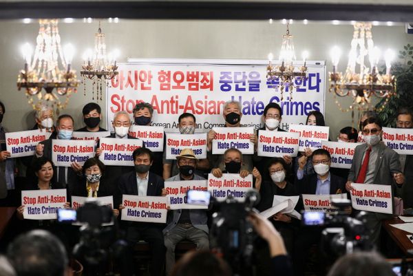 Members of the Atlanta Korean American Committee against Asian Hate Crime pose with placards during a group photo as they meet at Ching Dam, a Korean restaurant, after the fatal shooting at three Georgia spas, in Duluth, Georgia, U.S., 18 March 2021.  - Sputnik International