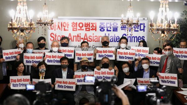 Members of the Atlanta Korean American Committee against Asian Hate Crime pose with placards during a group photo as they meet at Ching Dam, a Korean restaurant, after the fatal shooting at three Georgia spas, in Duluth, Georgia, U.S., 18 March 2021.  - Sputnik International