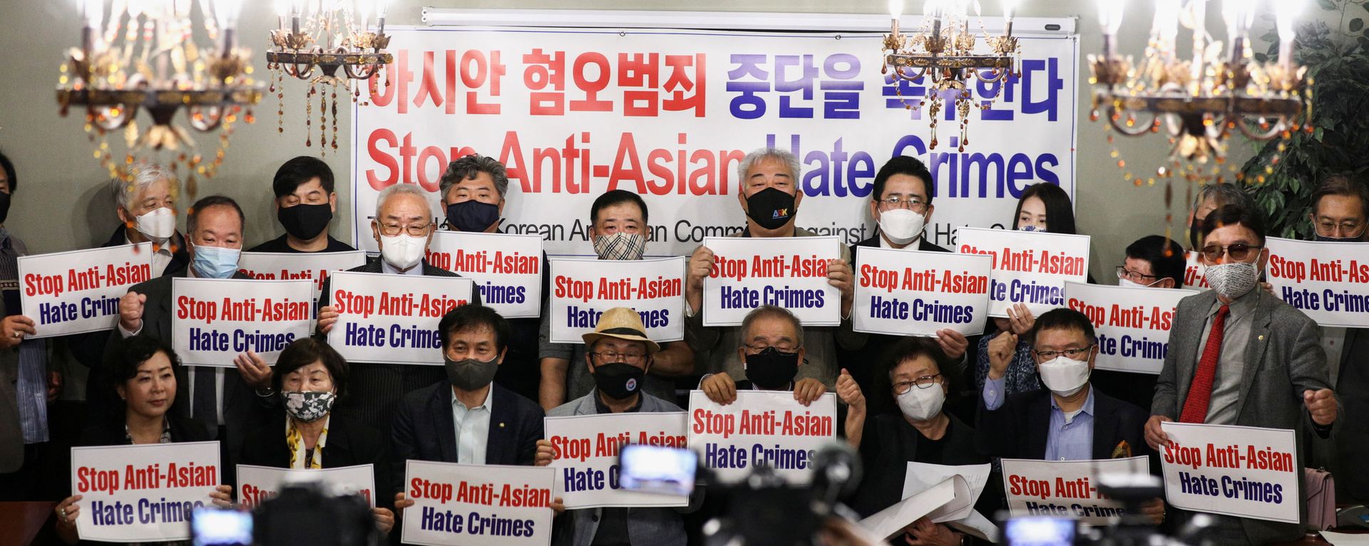 Members of the Atlanta Korean American Committee against Asian Hate Crime pose with placards during a group photo as they meet at Ching Dam, a Korean restaurant, after the fatal shooting at three Georgia spas, in Duluth, Georgia, U.S., 18 March 2021. Members of the Atlanta Korean American Committee against Asian Hate Crime pose with placards during a group photo as they meet at Ching Dam, a Korean restaurant, after the fatal shooting at three Georgia spas, in Duluth, Georgia, U.S., 18 March 2021. - Sputnik International, 1920, 25.10.2021