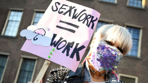 A protester holds a placard as Dutch sex workers demonstrate to demand the right to go back to work, amid the coronavirus disease (COVID-19) pandemic, in The Hague, Netherlands March 2, 2021 A protester holds a placard as Dutch sex workers demonstrate to demand the right to go back to work, amid the coronavirus disease (COVID-19) pandemic, in The Hague, Netherlands March 2, 2021 - Sputnik International