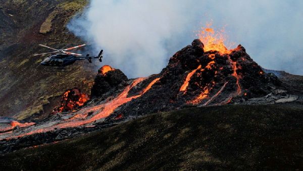 Lava flows from a volcano in Reykjanes Peninsula, Iceland March 20, 2021 in this picture obtained from social media. Picture taken March 20, 2021 - Sputnik International
