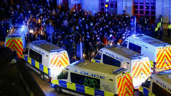 Demonstrators gather outside a police station during a protest against a new proposed policing bill, in Bristol, Britain, March 21, 2021.  - Sputnik International