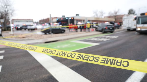 Police tape is seen at the perimeter of a shooting site at King Soopers grocery store in Boulder, Colorado, U.S. March 22, 2021.   - Sputnik International