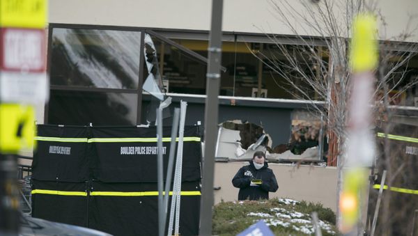 Police work on the scene outside of a King Soopers grocery store where authorities say multiple people were killed in a shooting, Monday, March 22, 2021, in Boulder, Colorado.  - Sputnik International