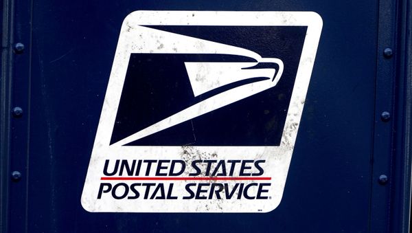 FILE PHOTO: The U.S. Postal Service (USPS) logo is pictured on a mail box in the Manhattan borough of New York City, New York, U.S., August 21, 2020. REUTERS/Carlo Allegri/File Photo - Sputnik International