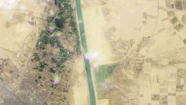 Planet Labs Inc satellite image shows the Ever Given, a container ship operated by the Evergreen Marine Corporation, stranded in the Suez Canal, Egypt March 23, 2021. - Sputnik International