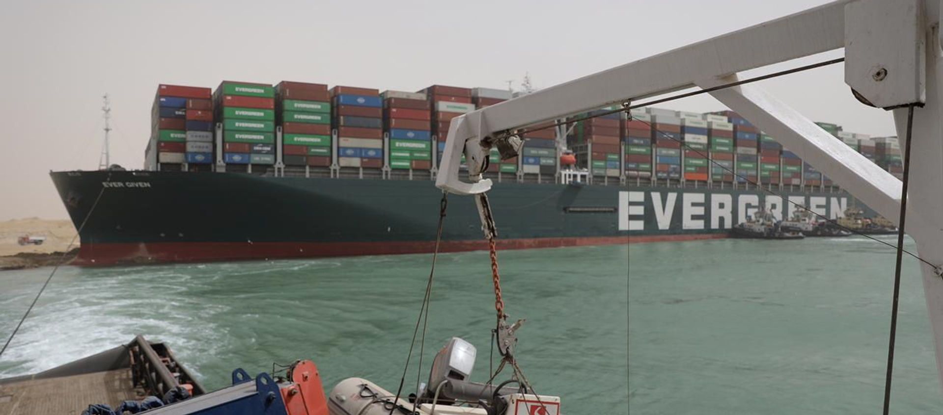 Stranded container ship Ever Given, one of the world's largest container ships, is seen after it ran aground, in Suez Canal, Egypt March 25, 2021 Stranded container ship Ever Given, one of the world's largest container ships, is seen after it ran aground, in Suez Canal, Egypt March 25, 2021 - Sputnik International, 1920, 25.03.2021