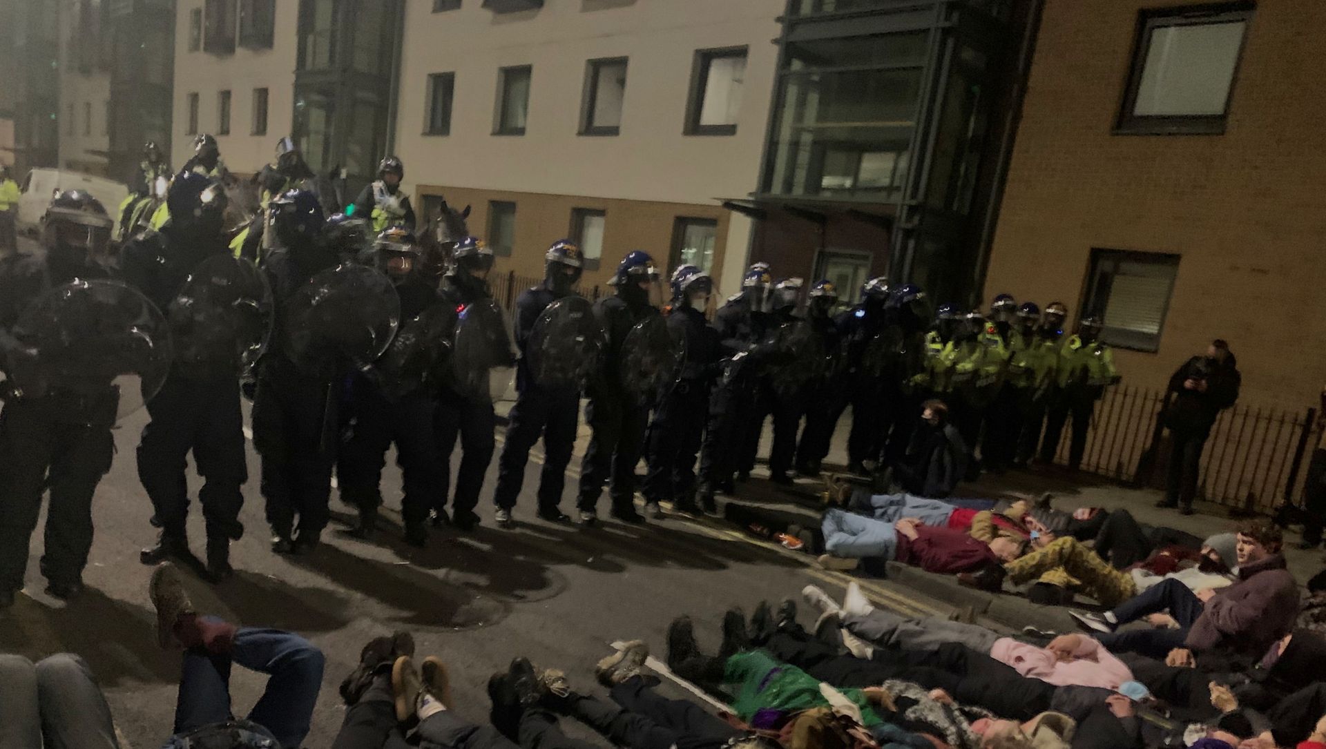 Police officers stand in position as protesters demonstrate against new policing laws in Bristol, Britain, early March 24, 2021, in this picture obtained from social media. Police officers stand in position as protesters demonstrate against new policing laws in Bristol, Britain, early March 24, 2021, in this picture obtained from social media. - Sputnik International, 1920, 28.03.2021