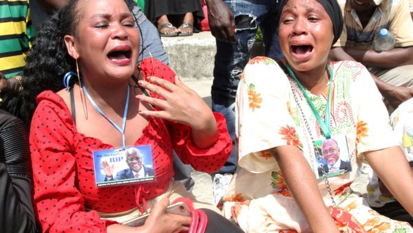 Civilians mourn late Tanzanian President John Pombe Magufuli during the state funeral procession at Uhuru stadium, the venue of the national requiem Mass in Dar es Salaam, Tanzania March 20, 2021 - Sputnik International