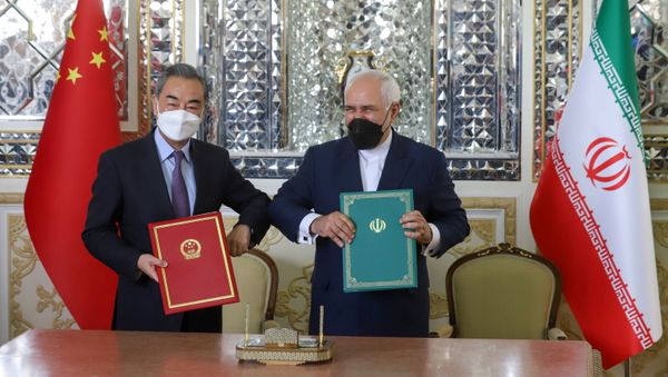 Iran's Foreign Minister Mohammad Javad Zarif and China's Foreign Minister Wang Yi bump elbows during the signing ceremony of a 25-year cooperation agreement, in Tehran, Iran March 27, 2021 - Sputnik International
