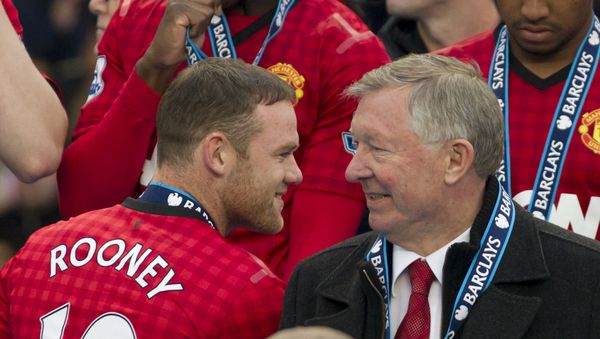 Manchester United's manager Sir Alex Ferguson, right, speaks to striker Wayne Rooney after his last home game in charge of the club, their English Premier League soccer match against Swansea, at Old Trafford Stadium, Manchester, England, Sunday May 12, 2013 Manchester United's manager Sir Alex Ferguson, right, speaks to striker Wayne Rooney after his last home game in charge of the club, their English Premier League soccer match against Swansea, at Old Trafford Stadium, Manchester, England, Sunday May 12, 2013 - Sputnik International
