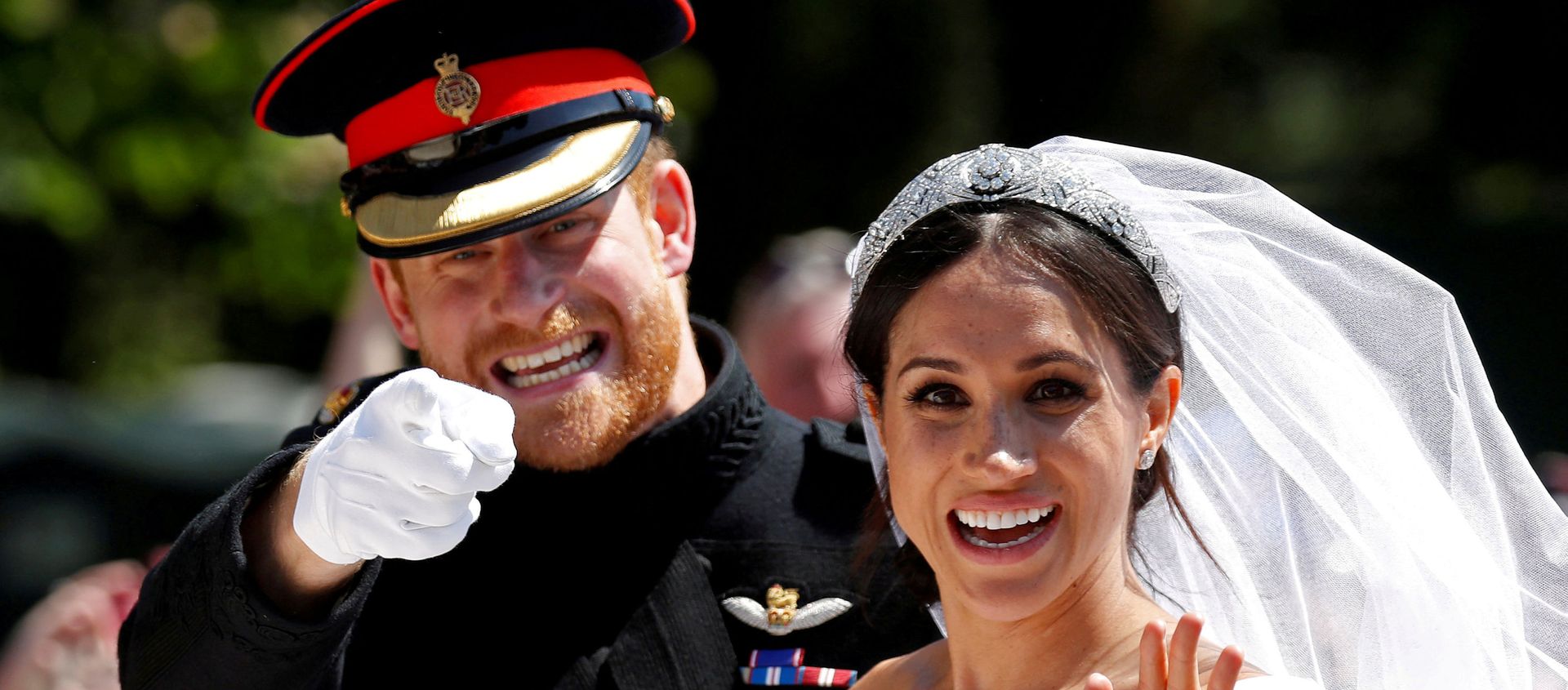 Britain’s Prince Harry gestures next to his wife Meghan as they ride a horse-drawn carriage after their wedding ceremony at St George’s Chapel in Windsor Castle in Windsor, Britain, May 19, 2018. Britain’s Prince Harry gestures next to his wife Meghan as they ride a horse-drawn carriage after their wedding ceremony at St George’s Chapel in Windsor Castle in Windsor, Britain, May 19, 2018. - Sputnik International, 1920, 17.04.2021