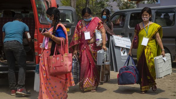 Election officers carry Electronic Voting Machines (EVM) as they leave for their respective polling stations on the eve of the Assam Assembly election in Majuli, India, Friday, March 26, 2021 Election officers carry Electronic Voting Machines (EVM) as they leave for their respective polling stations on the eve of the Assam Assembly election in Majuli, India, Friday, March 26, 2021 - Sputnik International