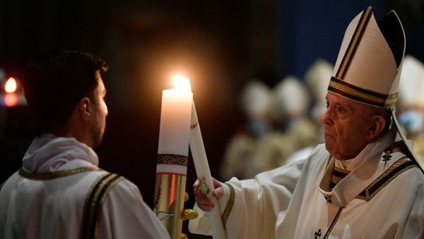Pope Francis celebrates the Easter Vigil in a near empty St. Peter's Basilica as the coronavirus disease (COVID-19) restrictions stay in place for a second year running, at the Vatican, April 3, 2021.  - Sputnik International