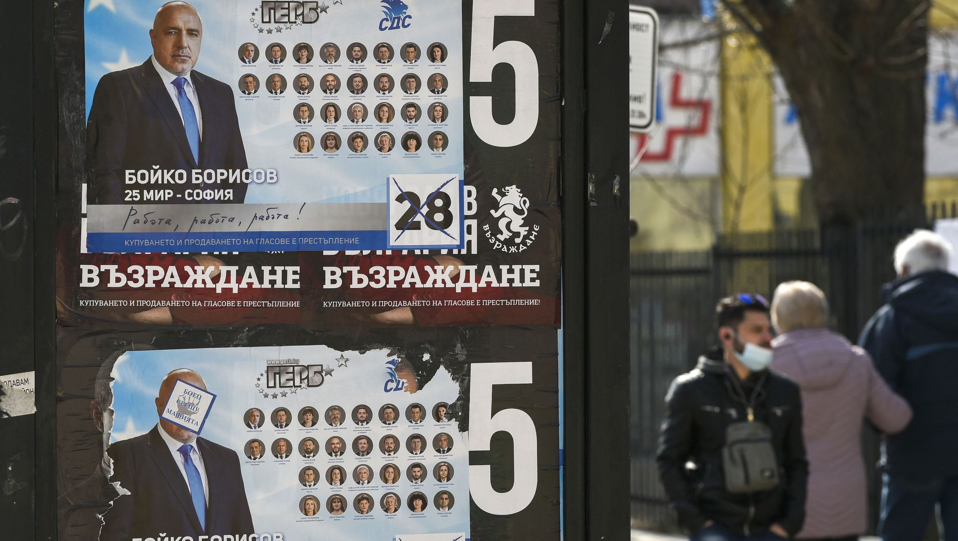 People walk past election posters of Bulgarian Prime Minister and leader of centre-right GERB party Boyko Borissov in Bankya on April 2, 2021, ahead of the General elections in two days. - Bulgarians will go to the polls on April 4, to elect a new parliament, with Prime Minister Boyko Borisov's centre-right party tipped to finish first despite a wave of anti-government protests last summer. While the latest polls give Borisov's GERB party an average lead of eight percentage points over the main opposition Socialists, analysts still expect the next parliament to be marked by more instability. People walk past election posters of Bulgarian Prime Minister and leader of centre-right GERB party Boyko Borissov in Bankya on April 2, 2021, ahead of the General elections in two days. - Bulgarians will go to the polls on April 4, to elect a new parliament, with Prime Minister Boyko Borisov's centre-right party tipped to finish first despite a wave of anti-government protests last summer. While the latest polls give Borisov's GERB party an average lead of eight percentage points over the main opposition Socialists, analysts still expect the next parliament to be marked by more instability. - Sputnik International, 1920, 04.04.2021