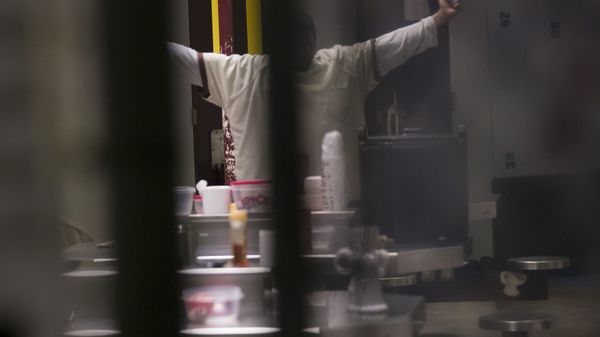 In this photo reviewed by U.S. military officials, a detainee, name and facial identification not permitted, stretches inside the Camp VI detention facility, Wednesday, April 17, 2019, in Guantanamo Bay Naval Base, Cuba. - Sputnik International