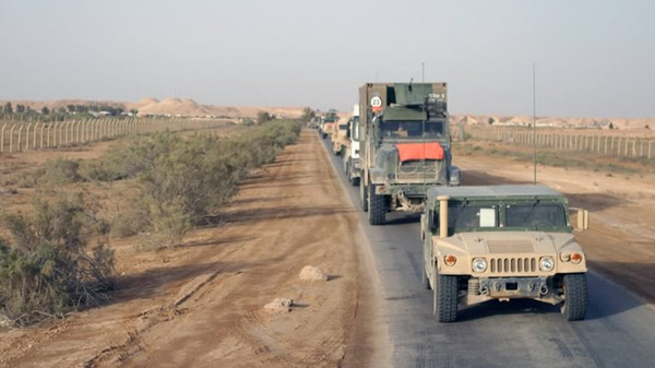 Purported image of smuggling of wheat and barley out of Syria by US-allied forces. - Sputnik International