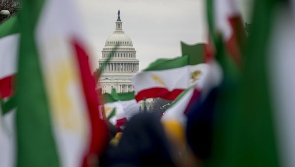The Dome of the U.S. Capitol building is visible through Iranian flags during an Organization of Iranian-American Communities rally at Freedom Plaza in Washington, Friday, March 8, 2019.  - Sputnik International