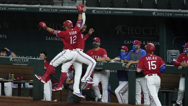 Texas Rangers' Rougned Odor (12) and Elvis Andrus celebrate Odor's two run home run that also scored Nick Solak (15) in the eighth inning of a baseball game against the Oakland Athletics in Arlington, Texas, Friday, Sept. 11, 2020 - Sputnik International