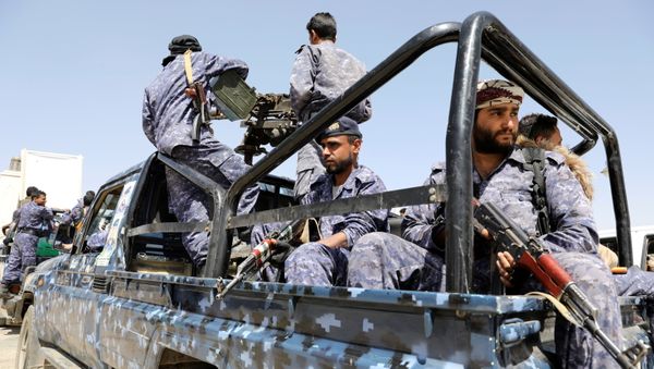 Police troopers ride on the back of a patrol truck following a funeral of Houthi fighters killed during recent fighting against government forces at different fronts, in Sanaa, Yemen March 23, 2021 - Sputnik International