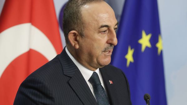 Turkey's Foreign Minister Mevlut Cavusoglu gives a joint statement with European Union foreign policy chief Josep Borrell prior to their meeting in Brussels, Thursday, Jan. 21, 2021. - Sputnik International