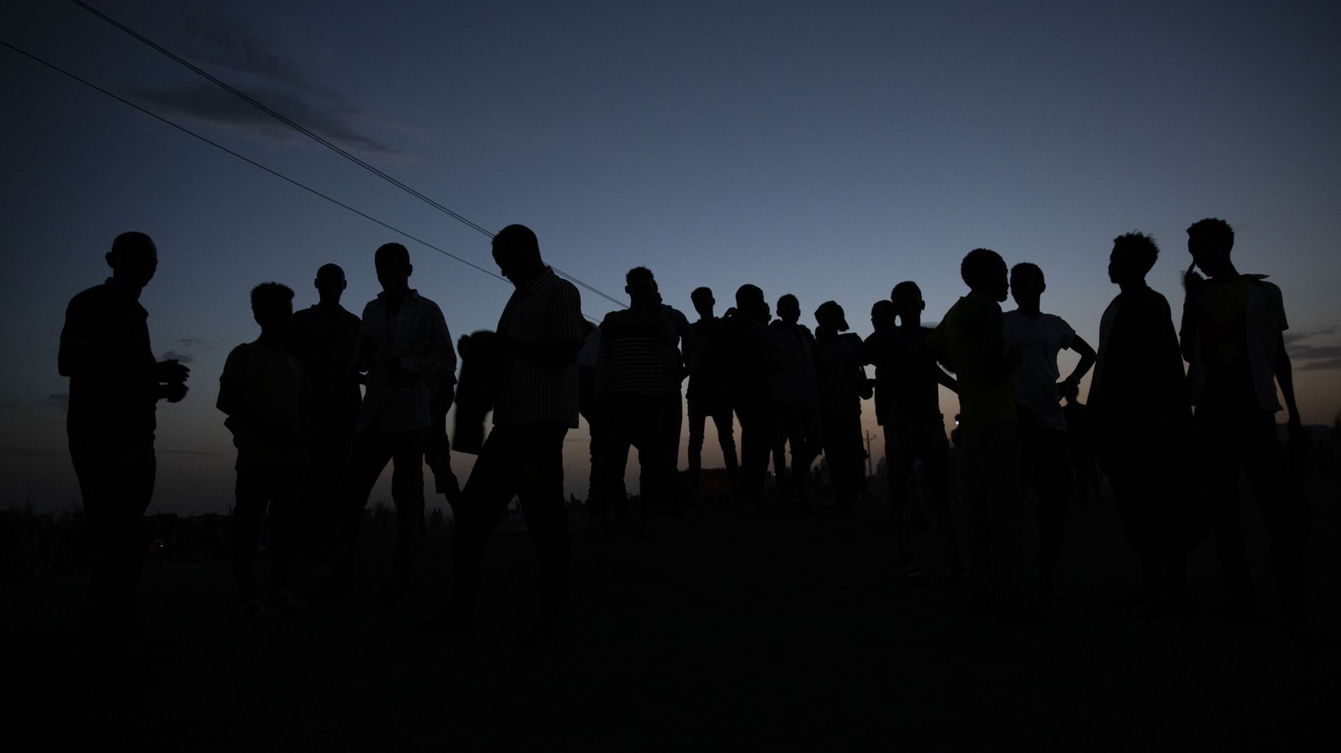 Tigrayan refugees who fled the conflict in the Ethiopia's Tigray gather after the sun sets in Hamdayet, eastern Sudan, near the border with Ethiopia, on March 23, 2021. For months, it has been the Tigrayans' word against that of the government in Ethiopia, Africa's second most populous country and one of its most powerful. But now, for the first time, there is official proof of what is being called ethnic cleansing in the form of identity cards smuggled across the border into this Sudanese border post and confirmed to The Associated Press by more than a half-dozen refugees from different communities. (AP Photo/Nariman El-Mofty) Tigrayan refugees who fled the conflict in the Ethiopia's Tigray gather after the sun sets in Hamdayet, eastern Sudan, near the border with Ethiopia, on March 23, 2021. For months, it has been the Tigrayans' word against that of the government in Ethiopia, Africa's second most populous country and one of its most powerful. But now, for the first time, there is official proof of what is being called ethnic cleansing in the form of identity cards smuggled across the border into this Sudanese border post and confirmed to The Associated Press by more than a half-dozen refugees from different communities. (AP Photo/Nariman El-Mofty) - Sputnik International, 1920, 08.04.2021