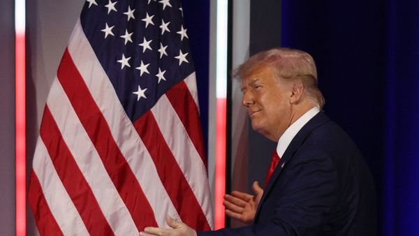 Former President Donald Trump embraces the American flag as he arrives on stage to address the Conservative Political Action Conference held in the Hyatt Regency on 28 February 2021 in Orlando, Florida. Joe Raedle/Getty Images/AFP (Photo by JOE RAEDLE / GETTY IMAGES NORTH AMERICA / Getty Images via AFP) Former President Donald Trump embraces the American flag as he arrives on stage to address the Conservative Political Action Conference held in the Hyatt Regency on 28 February 2021 in Orlando, Florida. Joe Raedle/Getty Images/AFP (Photo by JOE RAEDLE / GETTY IMAGES NORTH AMERICA / Getty Images via AFP) - Sputnik International