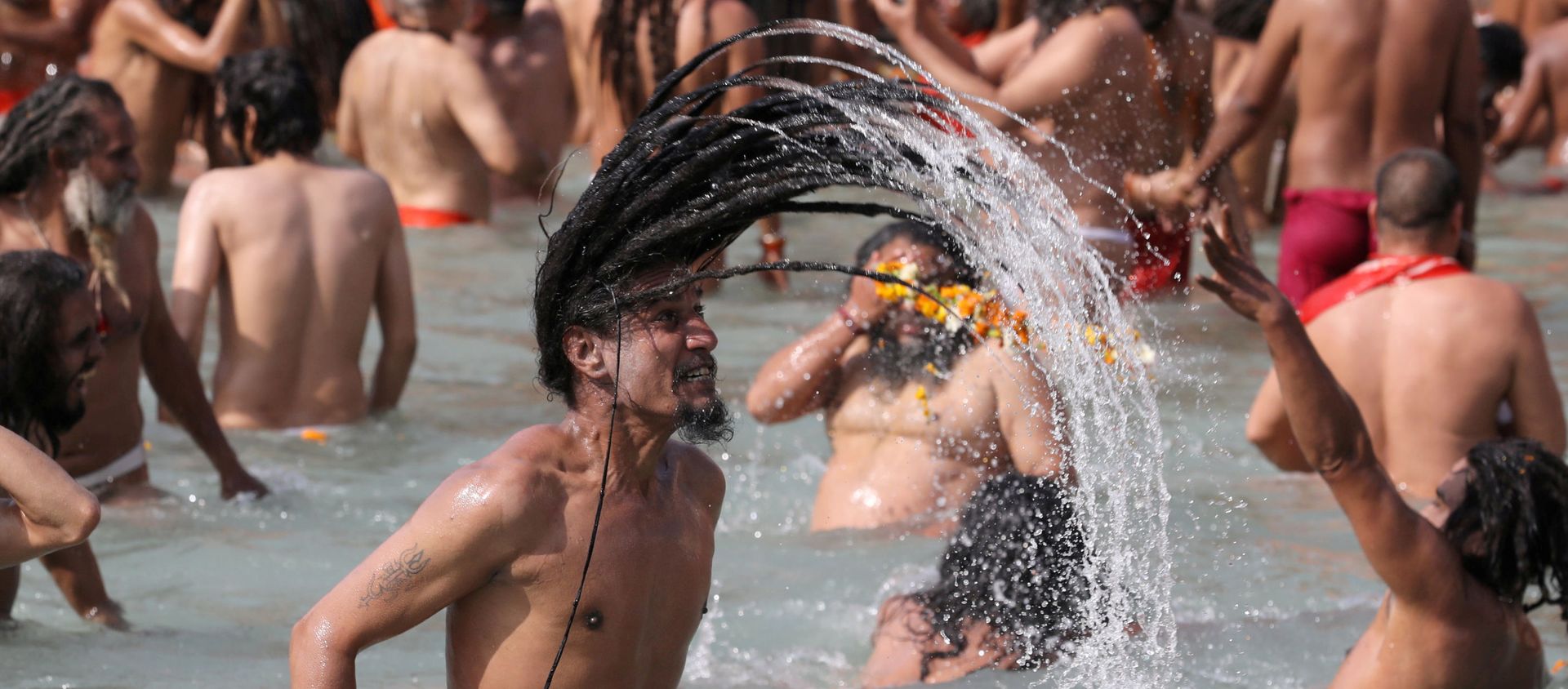 Naga Sadhus, or Hindu holy men, take a dip in the Ganges river during the first Shahi Snan at Kumbh Mela, or the Pitcher Festival, in Haridwar, India, March 11, 2021 - Sputnik International, 1920, 12.04.2021