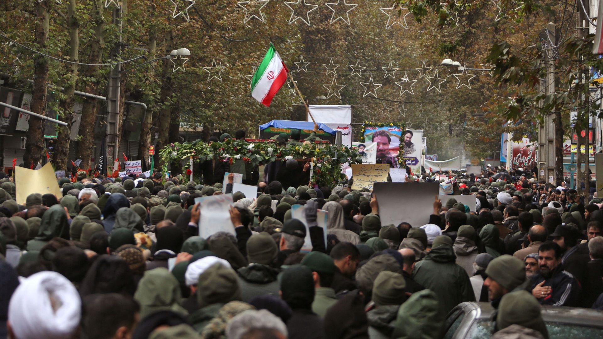 Iranian mourners attend the funeral of Morteza Ebrahimi, a commander of the Islamic Revolutionary Guard Corps, who was killed in violent demonstrations that erupted across Iran last week against a surprise petrol price hike, on November 20, 2019 in the central Iranian city of Shahriar. Iranian mourners attend the funeral of Morteza Ebrahimi, a commander of the Islamic Revolutionary Guard Corps, who was killed in violent demonstrations that erupted across Iran last week against a surprise petrol price hike, on November 20, 2019 in the central Iranian city of Shahriar. - Sputnik International, 1920, 12.04.2021